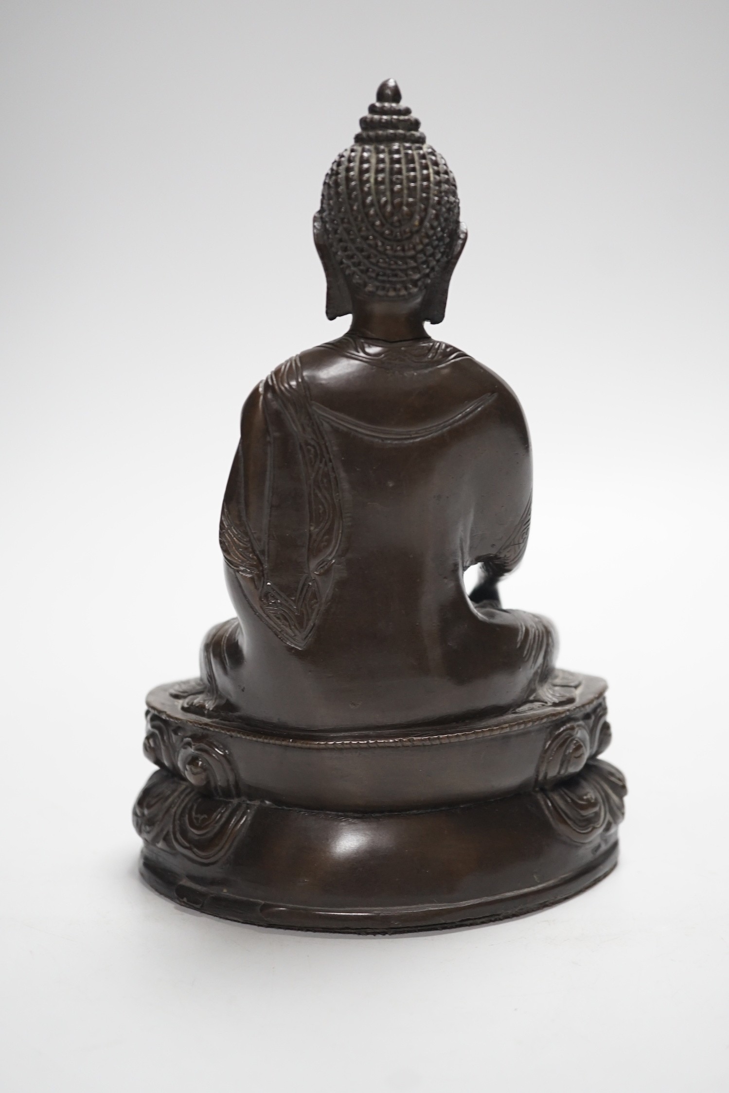 A Chinese bronze Buddha, on lotus base, 20cms high
